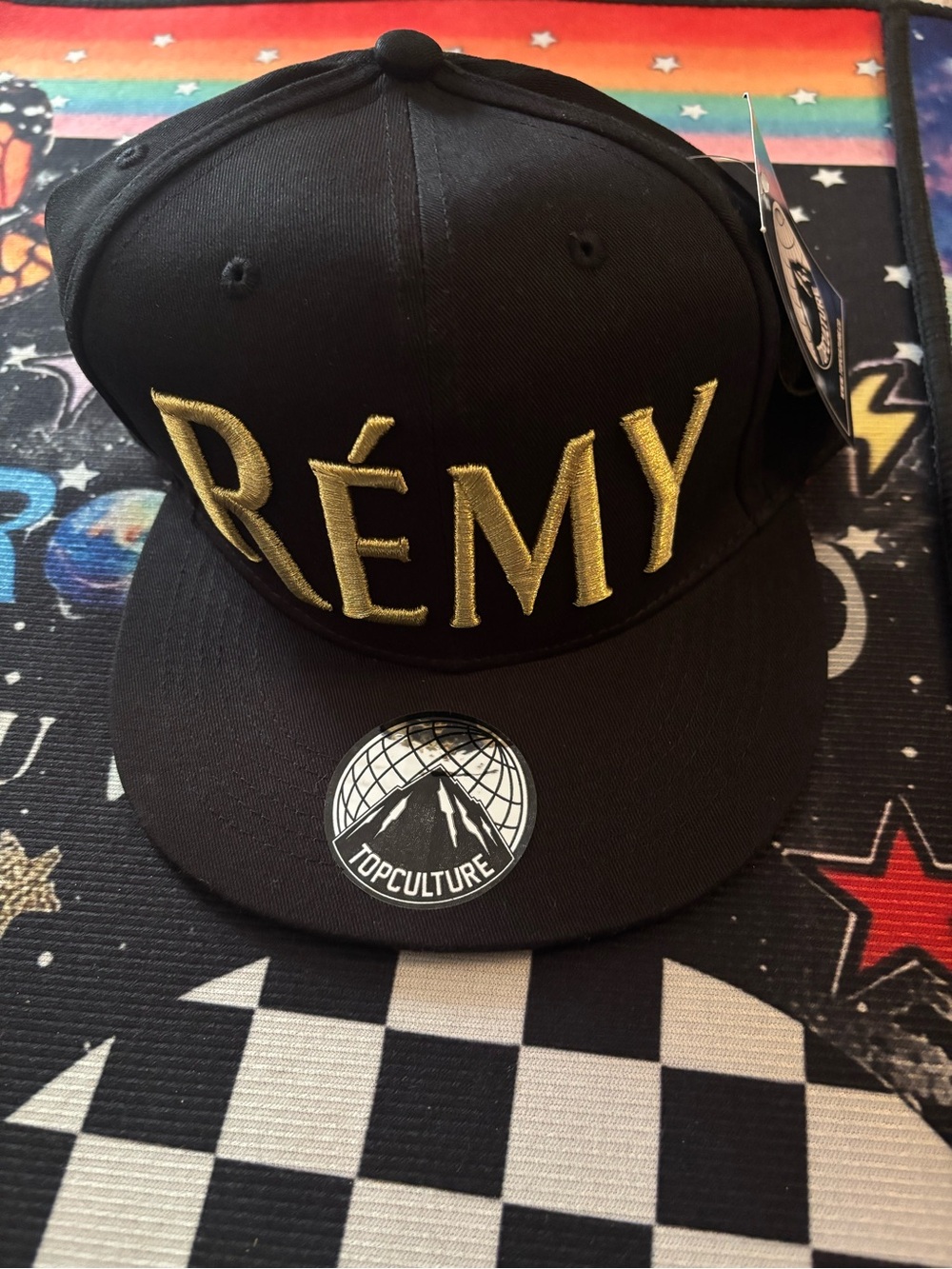 Black Snapback Hat with Gold RÉMY Embroidery